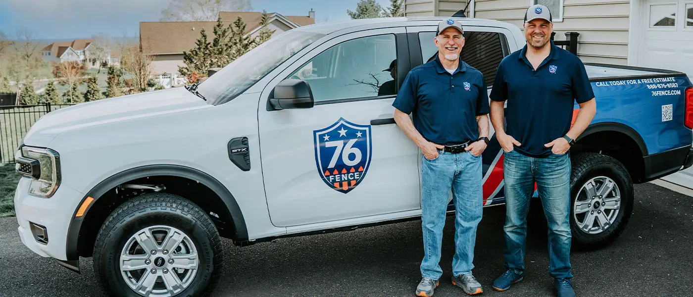 Tim Dunn and Eric Matsinger of 76 FENCE BucksMont beside a company truck
